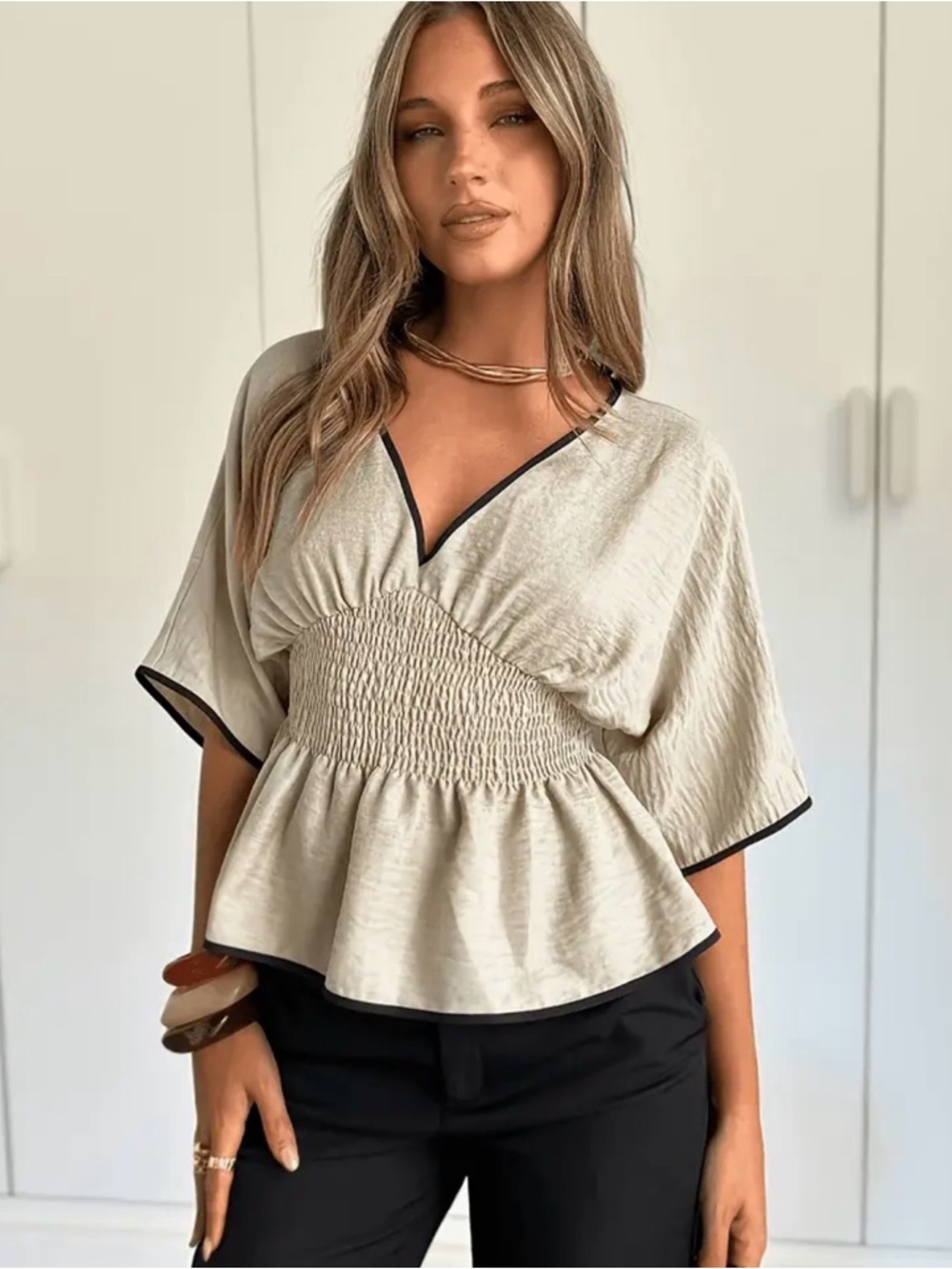 Women's Cream Smocked Peplum Top with Black Trim